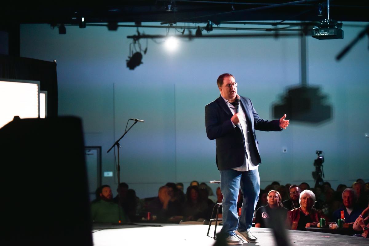 Comedian performing to a full room